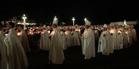 Pilgrims participate in the candlelight procession during an event marking the anniversary of the reported appearance of the Virgin Mary to three shepherd children, at the Catholic shrine of Fatima, Portugal, May 12, 2024. REUTERS/Maria Abranches