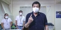 Philippine President Rodrigo Duterte shows his ink-stained finger after casting his ballot for the 2022 elections in Davao City, southern Philippines, on 9 May 2022. (Photo: EPA-EFE / Ace Moradante)