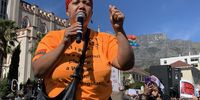 Lucinda Evans, Executive Director of Philisa Abafazi Bethu Women and Children's Program in Lavender Hill on the Cape Flat addresses the protest march against femicide and Gender Based Violence on 5 September 2019 outside Parliament in Cape Town. Photo: Anso Thom