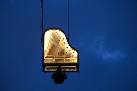 Pianist plays concert while hanging from a crane, and more from around the world