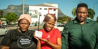 Community volunteers fitted temperature sensors to their vehicles and drove on pre-planned routes across their cities, collecting thousands of heat and humidity measurements. From left: Thamara Hela, Phamela Ketie and Musa Njube in Cape Town. (Photo: Chris Morgan for the World Bank)
