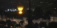 The cauldron, with the Olympic flame lit, lifts off while attached to a balloon during the Opening Ceremony of the Olympic Games Paris 2024 on July 26, 2024 in Paris, France. (Photo by Julien De Rosa-Pool/Getty Images)