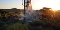 Striking water in the Karoo after a long day's drilling. Photographer: Johan Smit