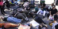 Protesters from various civil organizations and supporters lie-down to protest in solidarity with Palestinians, at the head offices of the Department of Trade and Industry in Pretoria, South Africa, 21 August 2025. The protesters claim that the export of South African coal to Israel powers Israel's coal-powered power stations and this constitutes support of Israel's attacks on the Palestinian people.  EPA/KIM LUDBROOK