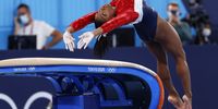 epaselect epa09370178 Simone Biles of the USA performs on the Vault during the Women's Team final during the Artistic Gymnastics events of the Tokyo 2020 Olympic Games at the Ariake Gymnastics Centre in Tokyo, Japan, 27 July 2021.  EPA-EFE/HOW HWEE YOUNG
