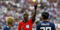 epa06847688 Zambian referee Janny Sikazwe shows the yellow card to Tomoaki Makino (R) of Japan  during the FIFA World Cup 2018 group H preliminary round soccer match between Japan and Poland in Volgograd, Russia, 28 June 2018.</p>
<p>(RESTRICTIONS APPLY: Editorial Use Only, not used in association with any commercial entity - Images must not be used in any form of alert service or push service of any kind including via mobile alert services, downloads to mobile devices or MMS messaging - Images must appear as still images and must not emulate match action video footage - No alteration is made to, and no text or image is superimposed over, any published image which: (a) intentionally obscures or removes a sponsor identification image; or (b) adds or overlays the commercial identification of any third party which is not officially associated with the FIFA World Cup)  EPA-EFE/SERGEI ILNITSKY   EDITORIAL USE ONLY