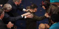 epaselect epa10376015 Ukrainian President Volodymyr Zelensky is greeted as he arrives to deliver an address to a joint meeting of the United States Congress in the House of Representatives chamber on Capitol Hill in Washington DC, USA, 21 December 2022. Zelensky is on his first known foreign trip since Russia invaded Ukraine more than 300 days ago, travelling to the US on a high-stakes visit to secure support for his war effort.  EPA-EFE/ERIC LEE