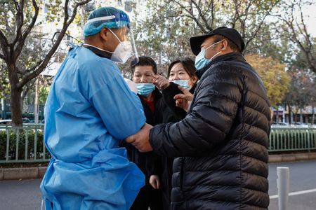 China Covid-19 cases rise, hard-hit Beijing tightens entry rules