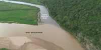 Stained by coal slurry, the colour of the Black iMfolozi River contrasts starkly with the White  iMfolozi River at the confluence o the two rivers. (Photo: D Gold)