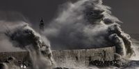 Waves crash over the lighthouse at the end of the breakwater on December 18, 2024 in Newhaven, England. The Met Office, the UK's national weather and climate service, forecast gales across parts of England and Wales today. (Photo by Dan Kitwood/Getty Images)