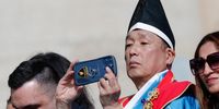 A man uses his phone during the weekly general audience led by Pope Francis in Saint Peter's Square, Vatican City, 24 April 2024.  EPA-EFE/GIUSEPPE LAMI