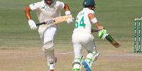 South African batsmen Dean Elgar (right) and Aiden Markram run between the wickets during the third day of the first cricket test match between Pakistan and South Africa in Karachi, Pakistan. (Photo: EPA-EFE / Shahzaib Akber)