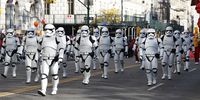 epa09603153 Performers dressed as Stormtrooper characters from 'Star Wars' march on Central Park West during the Macy's 95th Annual Thanksgiving Day Parade in New York City, New York, USA, 25 November 2021. The annual parade, which began in 1924, features giant balloons of characters from popular culture floating above the streets of Manhattan.  EPA-EFE/JASON SZENES