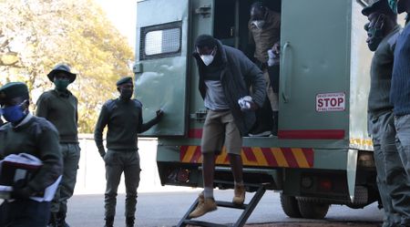 Whistle-blowing journalist remains in police custody as bail hearing is delayed