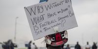 5 March 2022: Fans of various football teams protest outside Orlando Stadium before the Soweto Derby to demand that fans be allowed back into stadiums to watch and support their favourite teams. Picture: Ihsaan Haffejee