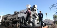 Memci van Wyk, Calvinia Museum curator, and her assistant Adonis de Wee, with the renowned Makadas steam loco. Image: Chris Marais<br>