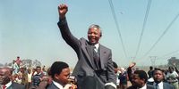 Nelson Mandela raises his fist while addressing a crowd in Thokoza, in what is now Ekurhuleni in Gauteng, on 5 September 1990. (Photo: AFP)