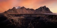 "Land of Fire". A sunrise at Vestrahorn, during my first trip to Iceland. The sky was burning on this November morning and the contrast with the black sand created this beautiful atmosphere. © Julien Visse, France, Shortlist, Open, Landscape, 2022 Sony World Photography Awards