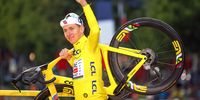 Tadej Pogačar of Slovenia and UAE Team Emirates - XRG - Yellow jersey winner celebrates at podium during Tour de France Stage 21, last and final stage of the 112th Tour de France 2025, a 132.3 km stage from Mantes-La-Ville to Paris Champs-Elysees on July 27, 2025 in Paris, France. (Photo by Sara Cavallini/Getty Images)