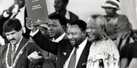 The signing of the Constitution of the Republic of South Africa in May 1996 ushered in a new era of constitutional democracy two years after the country's historic first democratic election and the installation of President Nelson Mandela. In this photograph, Cyril Ramaphosa and Mandela with the signed copy of the Constitution. (Photo: Gallo Images / Business Day / Robert Botha)