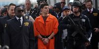 Luigi Mangione, suspect in the killing of UnitedHealthcare CEO Brian Thompson in New York City, arrives at a heliport with members of the NYPD on December 19, 2024 in New York City. The 26-year-old was arrested in Pennsylvania on December 9 after being spotted at a McDonald's in Altoona amid a national manhunt. Mangione also appeared in a Pennsylvania court on forgery and firearms charges today, where he waived extradition to New York after being indicted on 11 charges including first-degree murder in furtherance of terrorism. (Photo by Spencer Platt/Getty Images)