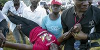 An injured supporter of Robert Kyagulanyi Ssentamu, otherwise known as Bobi Wine, is carried away during his presidential campaign in Kampala, Uganda. (Photo: EPA-EFE / STR)