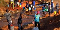 Magwegwe and Lobengula residents fetch water flowing from the Magwegwe reservoir in Bulawayo. (Photo: Darlington Mwashita)
