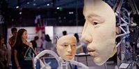 epaselect epa12198385 A woman looks at robotic human faces on display in a shop in the Xintiandi area, which translates to 'new heaven and earth' and is known for trendy, high-end shopping and restaurants in Shanghai, China, 26 June 2025.  EPA/ALEX PLAVEVSKI