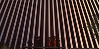 NOGALES, AZ - JULY 22:  Children look from the Mexican side of the U.S.-Mexico border fence at dusk on July 22, 2018, in Nogales, Arizona. President Trump has proposed replacing the fence with a wall.  (Photo by John Moore/Getty Images)
