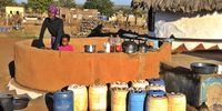 Johannah Skhelisi lives near one of the communal taps in Muyexe. On days when the water runs from the tap she is up as early as 3am to fill up containers with drinking water. (Photo: Lucas Ledwaba / Mukurukuru Media)