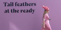 A woman walk past a sign which reads 'Tail feathers at the ready' during Ladies' Day at the Epsom Races at Epsom Racecourse June 02, 2023 in Epsom, England. (Photo by Sam Mellish/Getty Images)