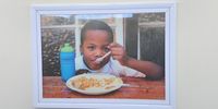 A child enjoying a meal provided by the Peninsula School Feeding Association in Philippi. (Photo: Naomi Campbell)