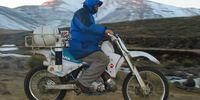 Wrapped up against the snow, Dr Johann Rall races to move endangered minnows  to another  part of Lesotho.Photo:Supplied