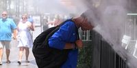 Robert A. places his head in the misters during an excessive heat warning in Las Vegas, Nevada, U.S. July 17, 2023.  REUTERS/Bridget Bennett     TPX IMAGES OF THE DAY