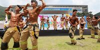 Firefighters take part in the bodybuilding event during a firefighting skills contest at the National Fire Service Academy in Gongju, South Korea, 13 June 2023.  EPA-EFE/YONHAP SOUTH KOREA OUT