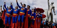 Filipino fans wearing Superman costumes gesture during the 'Superman Look Up Fan Meet' in Manila, Philippines, 19 June 2025. The 'Superman' movie world tour kicks off in the Philippines. The movie is scheduled for an international release on 09 July 2025.  EPA-EFE/FRANCIS R. MALASIG