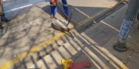A Johannesburg Roads Agency employee opens a manhole cover in Doornfontein. (Photo: Sean Christie)