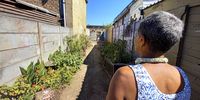 The mother pictured here said this alley in Dura Flats in Atlantis in Cape Town is a no-go-zone for residents when the sun sets. (Photo: Vincent Cruywagen)