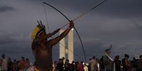 epa09888943 Indigenous people participate in the act 'A Queda do Ceu' at the Esplanada dos Ministerios in Brasilia, Brazil, 13 April 2022. During the act, indigenous leaders, politicians and artists will speak out against the bills that are part of the anti-indigenous agenda of the Federal Government. One bill is PL 191/2020, which authorizes the exploitation of indigenous lands, including places where isolated and recently contacted peoples live, was urgently processed in Congress.  EPA-EFE/Joedson Alves