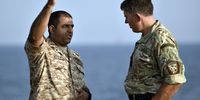 A Royal Navy captain speaks to a naval officer from the UAE during a joint exercise. (Photo: EPA / Mazen Mahdi)