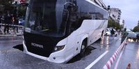 A view of a passenger bus after it fell with the front part into a five-meter pit while carrying 15 passengers, in a central avenue in Thessaloniki, northern Greece, 15 October 2021, as heavy rainfall hit the city. No injuries have been reported and the passengers were safely evacuated.  EPA-EFE/DIMITRIS TOSIDIS