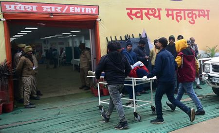Bodies, clothes, bags lie on ground after stampede at mass Hindu gathering in India