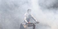 epa09887981 A cyclist pedals into heavy air pollution caused by a roadside garbage dump, in Bangalore, India, 13 April 2022. Bangalore air is currently 2.4 times above the WHO annual air quality guideline value. Indian city are struggling with heavily polluted air as air quality hit 'severe levels,' according to reports.  EPA-EFE/JAGADEESH NV