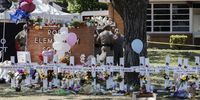 Crosses bearing names of victims line an area on school ground following a mass shooting at the Robb Elementary School in Uvalde, Texas, USA, 26 May 2022. According to Texas officials, at least 19 children and two adults were killed in the shooting on 24 May. The eighteen-year-old gunman was killed by responding officers. (Photo: EPA-EFE/Tannen Maury)