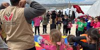 Mohammed leads activities for children at a camp for people displaced by the earthquakes in northwest Syria. <br>(Photo: @UNICEF / Fricker)