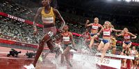 epa09395187 Peruth Chemutai (L) of Uganda is on her way to win the women's 3,000m Steeplechase final during the Athletics events of the Tokyo 2020 Olympic Games at the Olympic Stadium in Tokyo, Japan, 04 August 2021.  EPA-EFE/DIEGO AZUBEL