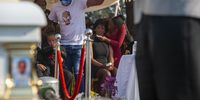 Mother of Nathaniel Julies (black dress) is comforted by her daughter as she watches the coffin of her late son in Johannesburg, South Africa on 5 September 2020. (Photo: Shiraaz Mohamed)