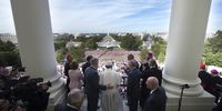 Pope Francis is welcomed to the Speakers Balcony at the US Capitol by members of congress, September 24, 2015 in Washington, DC. Pope Francis will be the first Pope to ever address a joint meeting of Congress. The POpe is on a six-day trip to the U.S., with stops in Washington, New York City and Philedelphia. (Photo by Doug Mills-Pool/Getty Images)