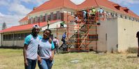 YouLead Warriors Lunathi Jibilikile (left) and Inga Mtshitshi (right) pose in front of the solar panel instillation. They are both in Grade 11 at the Centre of Science and Technology secondary school in Khayelitsha. Photo: Christi Nortier.
