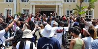 UCT students gather at Graça lawn on campus in February 2023 to picket for accommodation. They later marched to the Bremner Building to air their demands. (Photo: Xabiso Mkhabela)